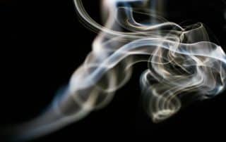 Abstract swirling smoke on black background