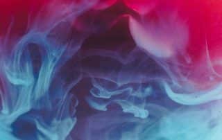 Colorful smoke in red and blue hues